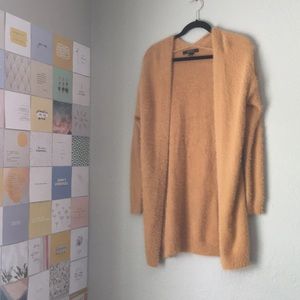 Fuzzy mustard colored sweater